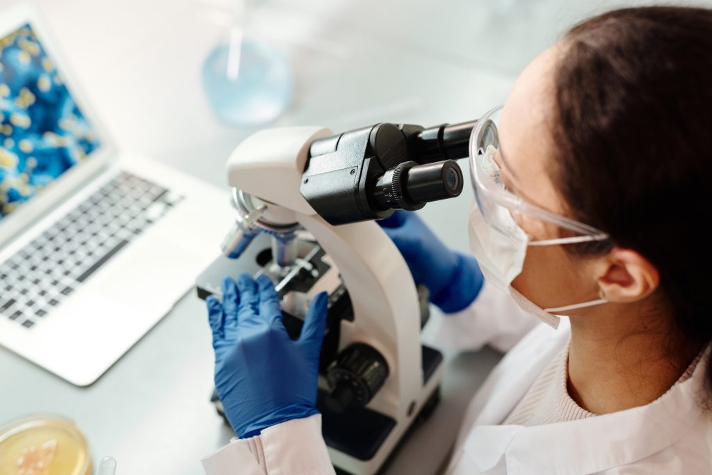 Woman scientist on the microscope